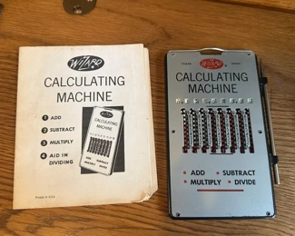 Vintage calculating machine with manual 