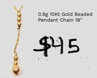 Delicate 14 karat gold beaded pendant