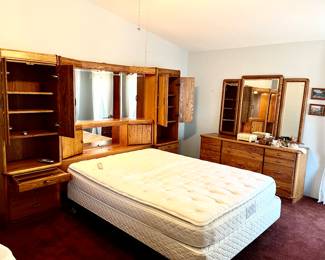 bedroom set wall unit fit a king or queen bed , 9 1/2 feet long, 6.2 feet tall 17 inches deep with built-in cabinets,, nightstands pull out tray for drinks / food also at the very top of the cupboard is a hidden cupboard for valuables $200 price to sell, comes apart and sections for easy move