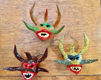 We have three signed Puerto Rico Vejigante paper mache masks