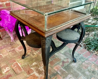 antique cast iron Soda Fountain Table with swing out stools and lift up glass tabletop