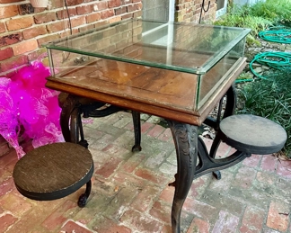 antique cast iron Soda Fountain Table with swing out stools and lift up glass tabletop