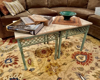 two marble top tables set up as one coffee table here. metal bases. selling as a pair