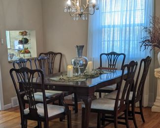 Harden Furniture Chippendale Dining Set w/Ball & Claw feet.  Seats up to 12-14 people. Solid Mahogany w/ cherry finish, sculpted corners & beveled edging & carved legs  64 x 44 x 29.5 (up to 112" w/ 3 leaves attached) Includes: 2-arm chairs, 6 side chairs, 3-16" leaves & storage covers, custom table pads to fit full length