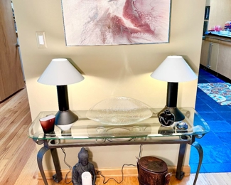 Metal and glass console table with a pair of zinc lamps by Ron Rezek.