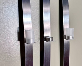 Wall mount candle holders.