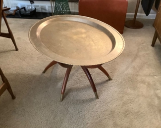 Spider table with brass oval top