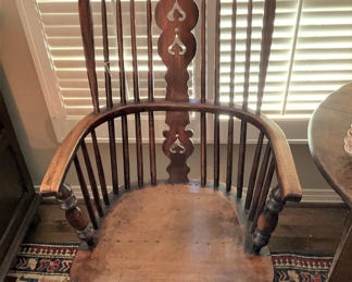 One of several antique Windsor chairs in the home
