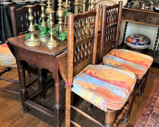 4 matching antique chairs; antique drop leaf table; many brass candlesticks