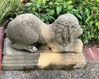 One of two concrete crouching lion garden statue  