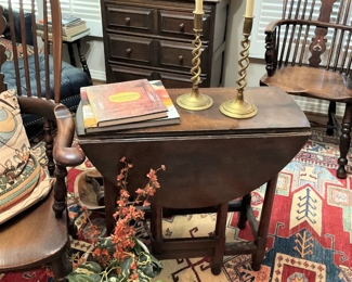 Antique oak drop leaf table; brass barley twist candlesticks