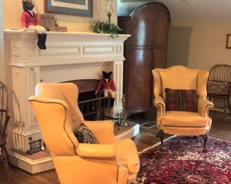 Matching yellow leather wingback chairs