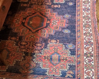 Antique rug in reds and blues