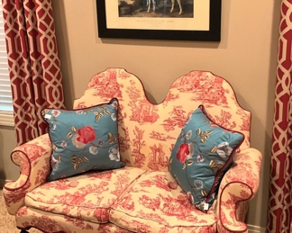 Antique settee with toile upholstery
