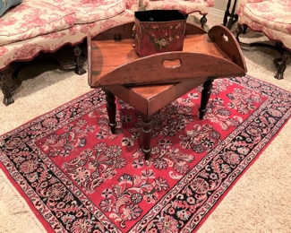 Antique rug; small antique table; butler's tray