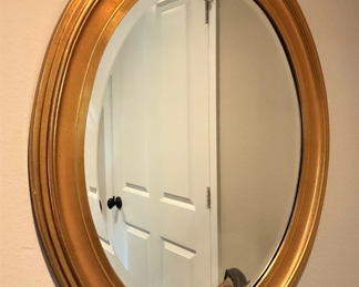 Gold-toned oval mirror