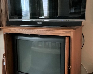 Samsung TV on top; Sony TV on bottom