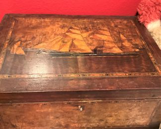 Antique box with sailing vessels on top