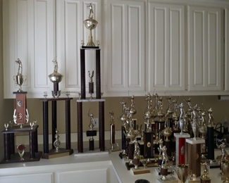 Vintage golf trophies. Their son was a state and national champion in high school and college for golf.