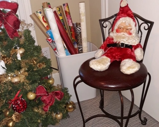 Christmas decor including a vintage rubber face Santa stuffed doll