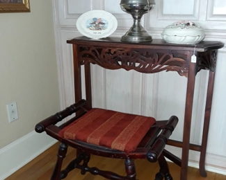 Small entry table, bench, and antique oil lamp.