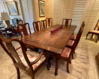 GORGEOUS VERY LARGE ENGLISH COUNTRY STYLE DINING TABLE, WITH HAND HEWN TOP. HAS TWO LEAVES WHICH CAN BE ADDED AT EACH END OF THE TABLE. TEN QUEEN ANNE STYLE DINING CHAIRS ( HAS TWO ARMCHAIRS.)