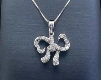Kay Jewelers "Open Hearts" by Jane Seymour Diamond Pave Open Double Heart Ribbon Bow Tie Pendant in White Gold; $1,100