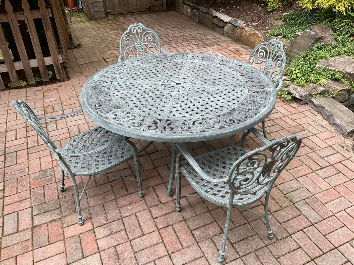 Tuscany Design Patio Table and chairs by Cast Classics Langrave bought at Seasons Two $2500