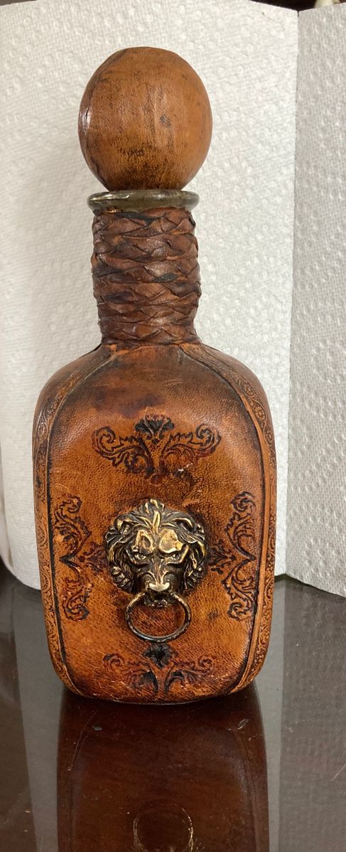 Leather bottle with lion’s head