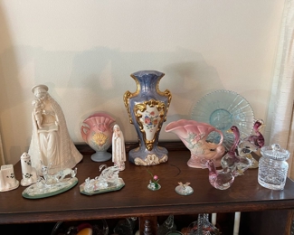 Hummel "Flower Madonna", Hull vases, Old Paris style lamp base, Northwood "Peacock on a Fence" Carnival glass plate, Waterford honey pot, Swarovski crystal swans