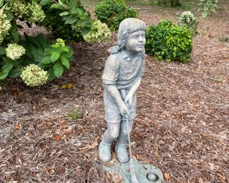 Golfing statue
