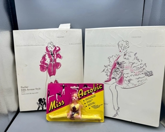 (2) Barbie Doll Outfits & Miss Aerobic Doll
Classique collection first in a series of limited edition fashions by Mattel Barbie designers Barbie fifth Avenue style fashion & Barbie Hollywood premiere fashion 
