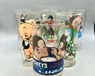 (6) Collectible Cups
This lot features drinking glasses from Walt Disney Goofy as Marley's Ghost, Hershey's chocolate, and Looney Tune characters including Petunia Pig, Daffy Duck, Pepe Lepew, Porky Pig, and Wil E. Coyote 