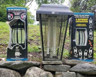 Outdoor Lights N Delights
Two 'Die Cadt Aluminum Laterns' with '6 different configurations' still in box with wiring. Uses 100 watt A19 maximum bulbs. One 2 foot tall Sears Craftsman bug zapper light, plugged in- one bulb works one needs to be swapped out. 