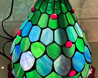 Tiffany Style Christmas Light
This lamp stands 11 in high and works perfectly! It appears to be missing a star at the top. A couple small imperfections as seen in photos. 
