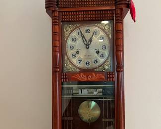Hand carved wall clock with pendulum & date