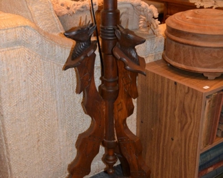antique wooden plant stand with deer carvings
