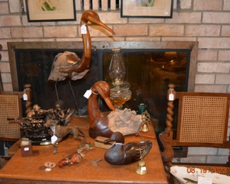 carved crane and duck, brass hunting dog figurine, wooden pipe, vintage oil lamp