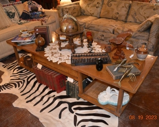 faux zebra rug - vintage coffee table - antique books, decor 