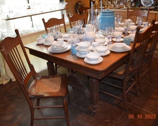 Antique oak dining table with 6 cane bottom chairs - excellent condition