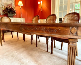 $1800; 66" x 44" x 29" (without leaves); 102" x 44" x 29" (with 2 leaves); Italian-crafted, elegant dining table with 2 leaves and carved vines along edges and columnar legs; table pads included