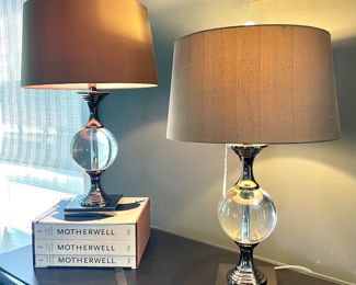 $350 each (2 available); 26"h; John Richard table lamps with metal and glass ball base. Modern and sleek. 