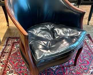 SOLD: 25" x 25" 32"; vintage black leather barrel chair with tufted seat cushion and air vents