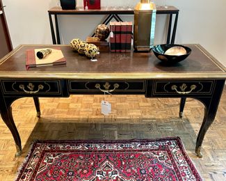 $2800; 66" x 29.5" x 31"; brass bound leather top Louis XV style bureau plat Baker Collector's Edition desk with brass hooved feet--spectacular. Leather top shows wear. 