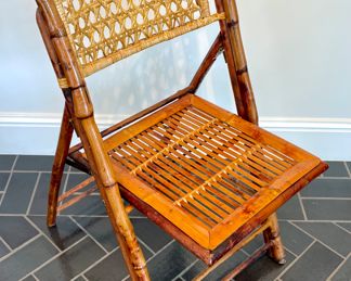 $120 each (8 available); 19" x 24" x 35";  vintage rattan folding chair with custom seat cushions;  2 additional available with the slat rattan back