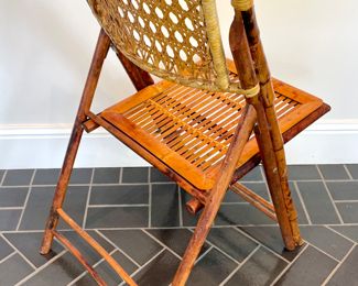 $120 each (8 available); 19" x 24" x 35";  vintage rattan folding chair (view of back) 2 additional available with the slat rattan back