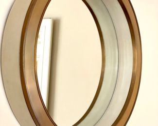$800; 30" diameter x 4.5" deep; Alden Parks Canberra Mirror; porthole mirror named after a svelte oceanliner with beveled glass, cream parchment leather and burled brass trim. HEAVY!