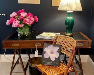 SOLD; 80" x 27" x 30"; authentic, vintage campaign-style writing desk with 2 drawers, leather top and folding legs. $180; 24"h; forest green and brass ginger jar lamp                              $400; 18" x 24"; set of 2 mixed-media originals by Jennifer Harroun in brass frames (minor humidity damage--price reflects)                                                                                     $120 each (8 available); 19" x 24" x 35";  vintage rattan folding chair                                                                                             $120; 12"d x 12"h; Sarreid Ltd brass and black bucket with rope-design trim