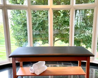 $500; 72" x 27" x 31"; H Brace treatment table with leather top and storage shelf; sells new for $826