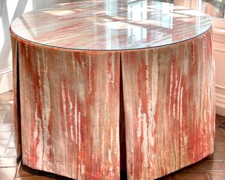 $450; 46"d x 29"h; round table with custom, pleated cloth cover and glass top